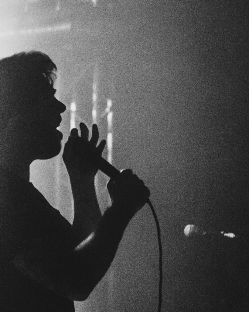 Singer performing on stage at a live show Singer performing on stage at a live show
